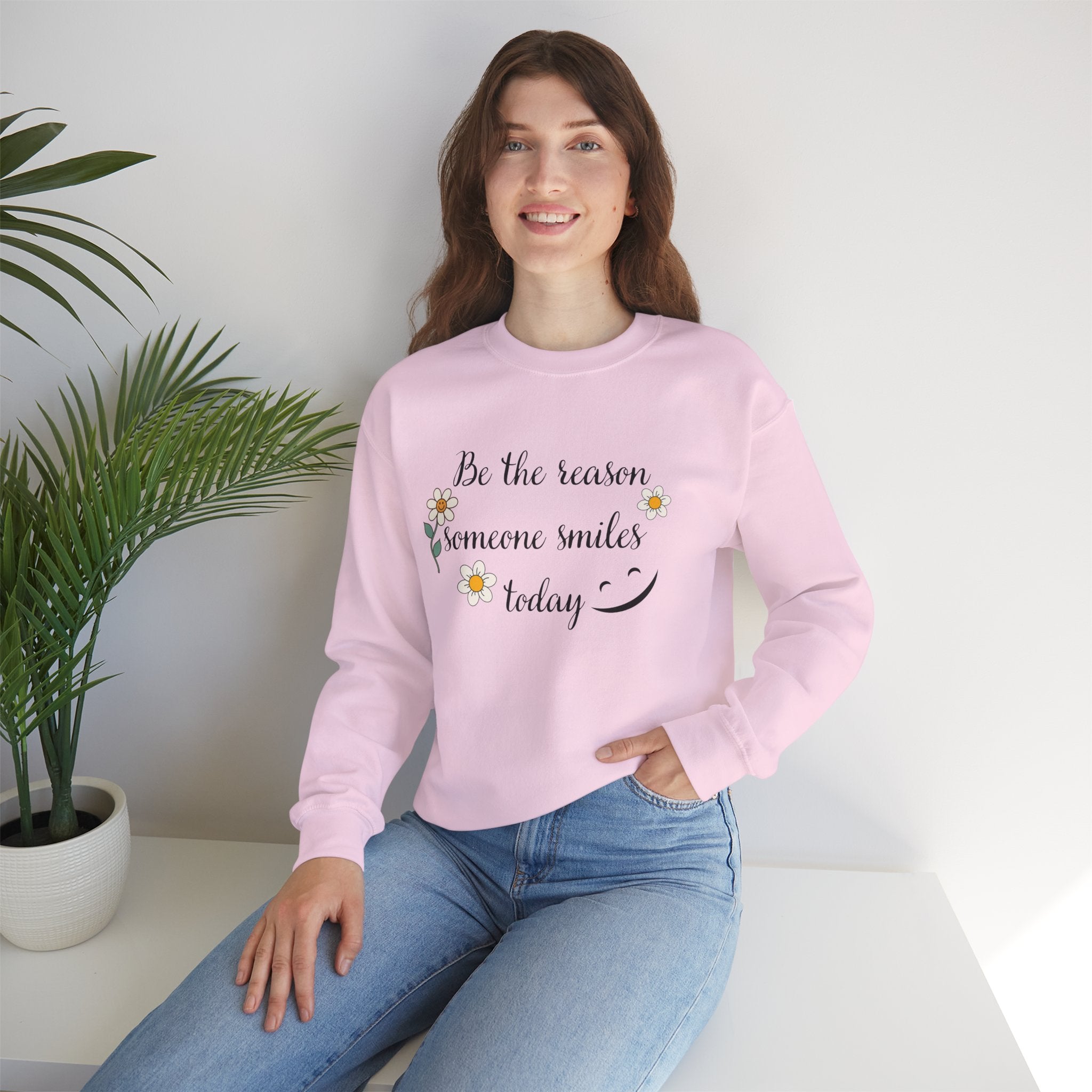 Sweatshirt with 'Be the reason someone smiles today' Quote